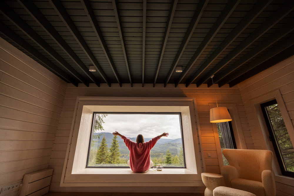 woman-relaxing-at-window-seat-enjoying-mountain-vi-2026-03-20-06-16-51-utc.jpg